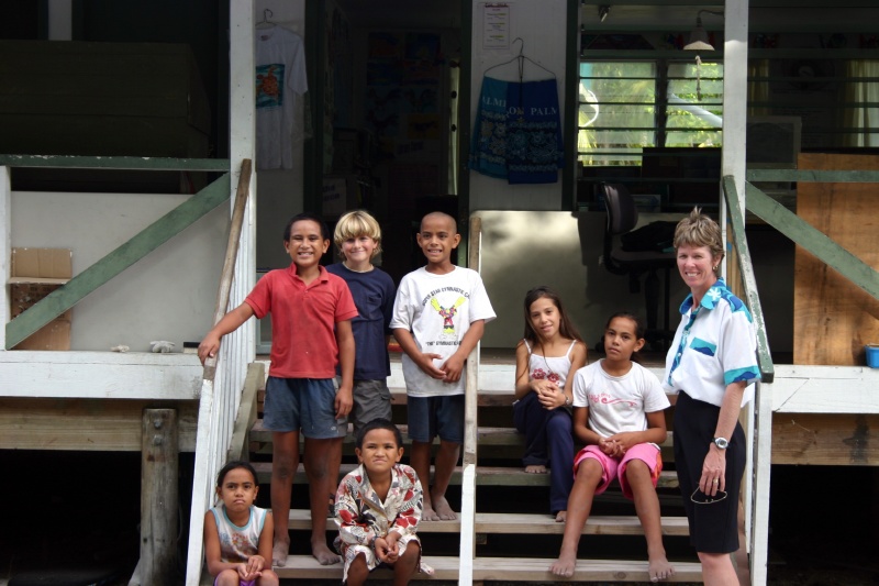 Principal/teacher Yvonne Marsters with the local kids and Matthew.